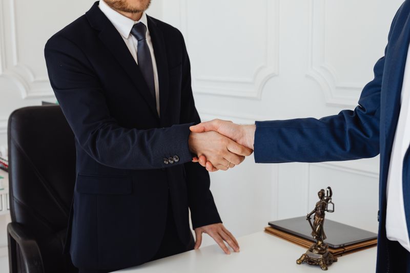 two people doing a handshake