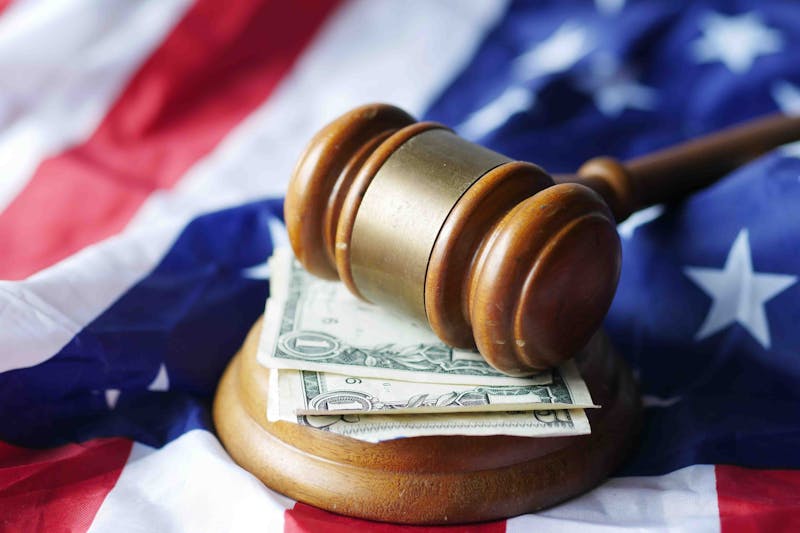 a gavel, a flag, and some cash